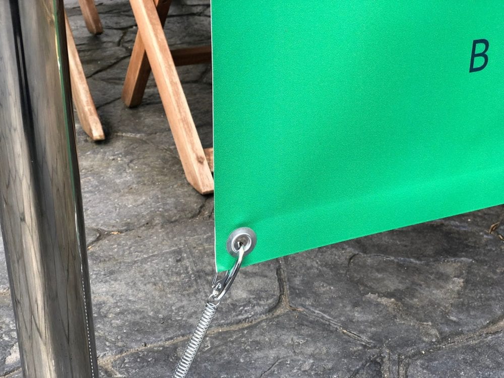 Double sided PVC banner with eyelets at bottom and pole pocket at top